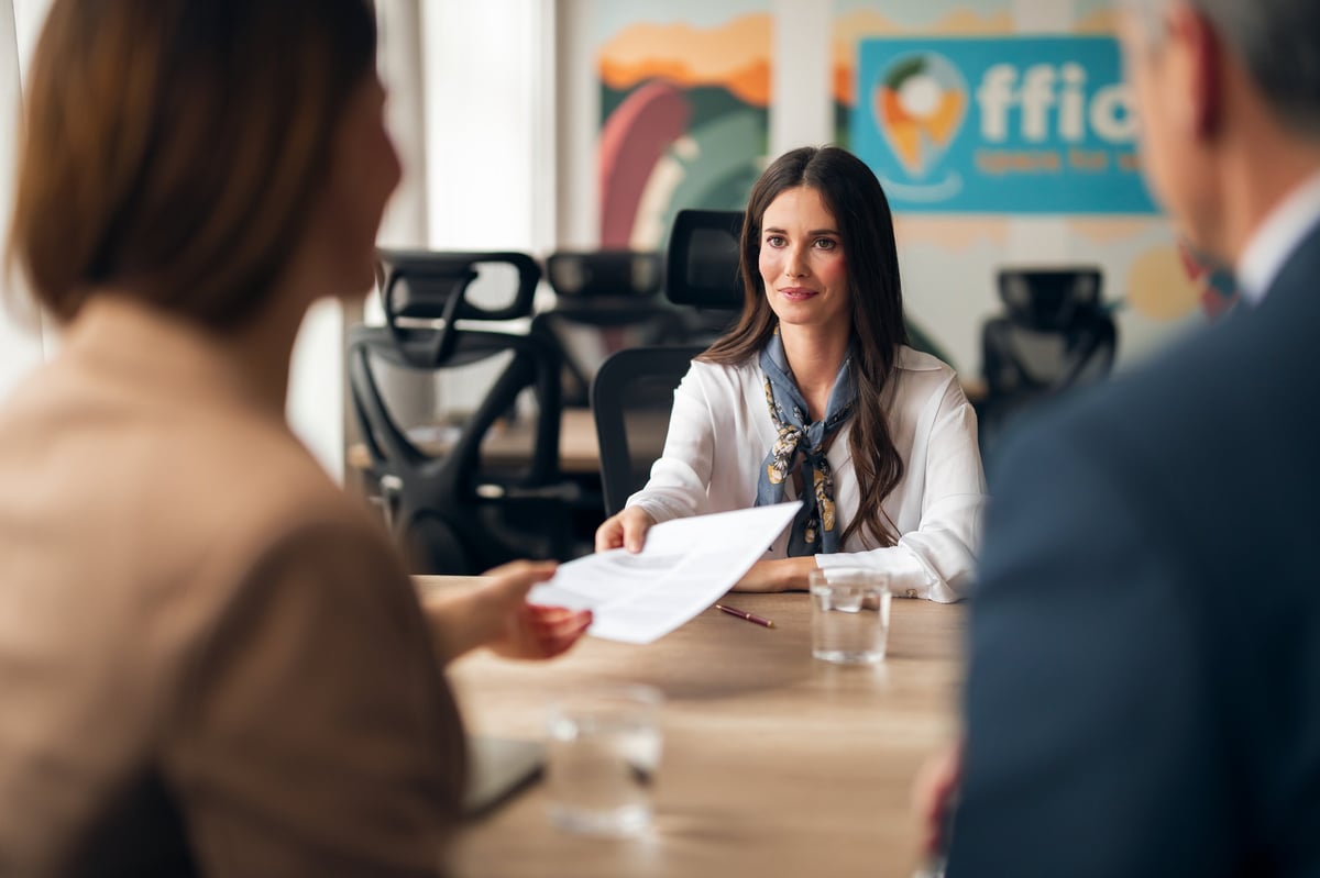 Business setting with a confident young professional during an office meeting in a contemporary workspace